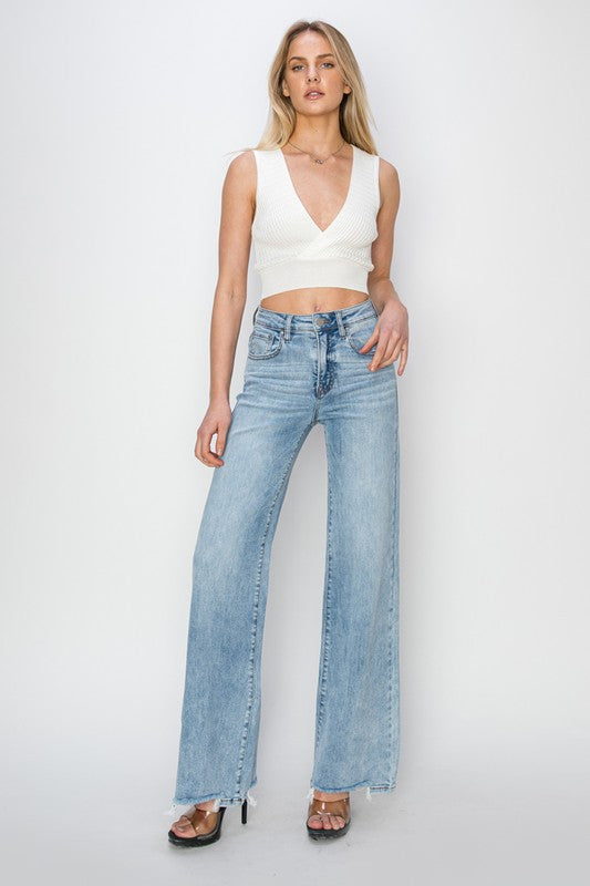 Risen High Rise Wide Leg Step Hem Jeans