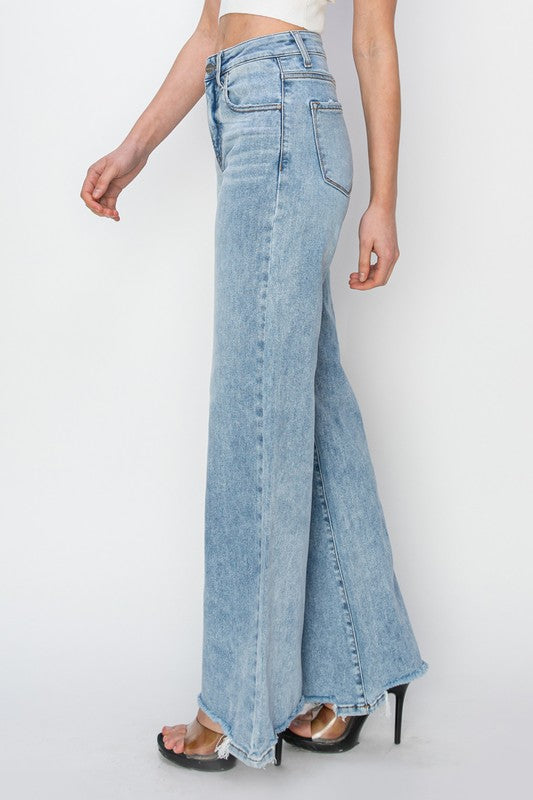 Risen High Rise Wide Leg Step Hem Jeans