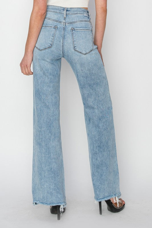 Risen High Rise Wide Leg Step Hem Jeans